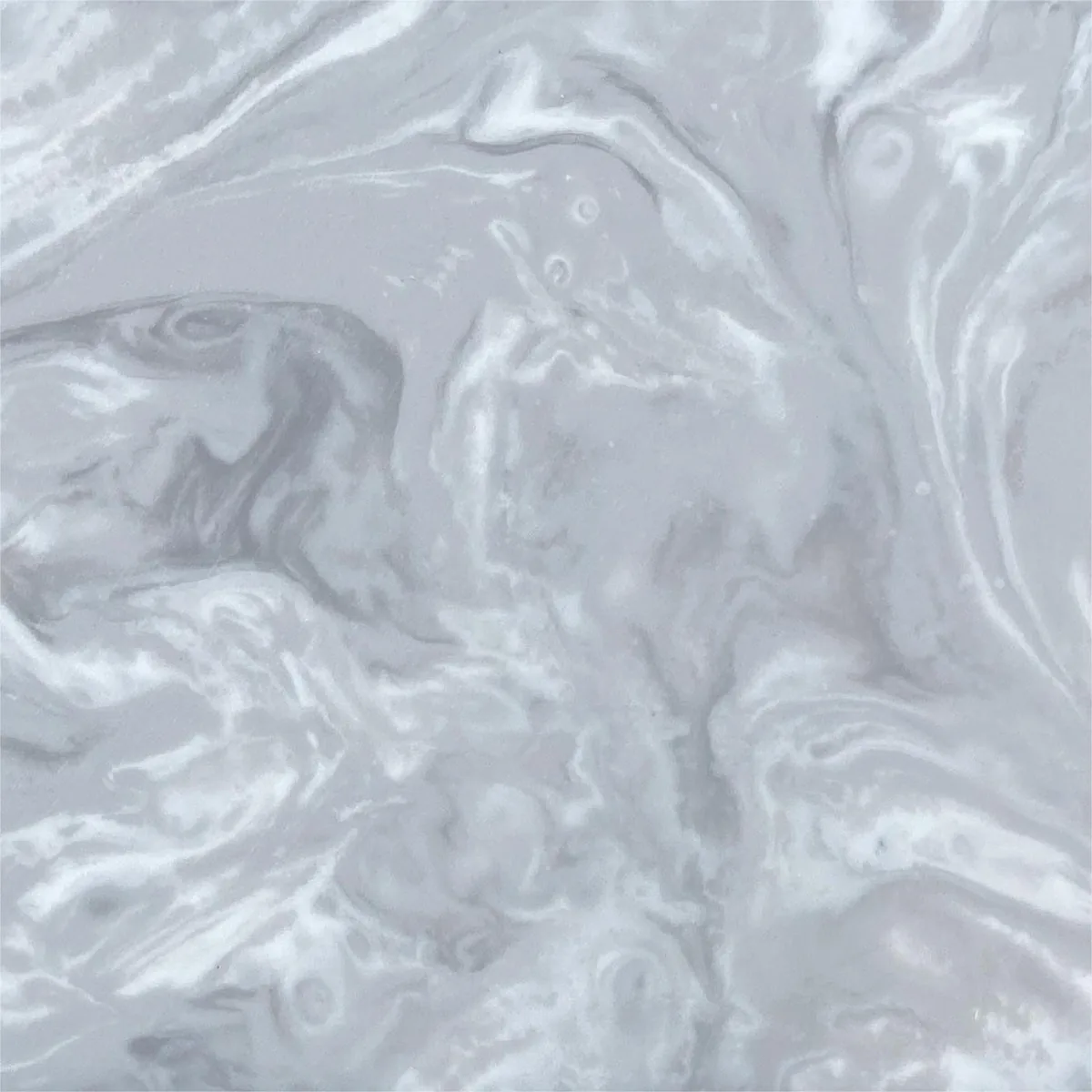 Flowing pale gray veins in ESHINE marble-effect solid surface